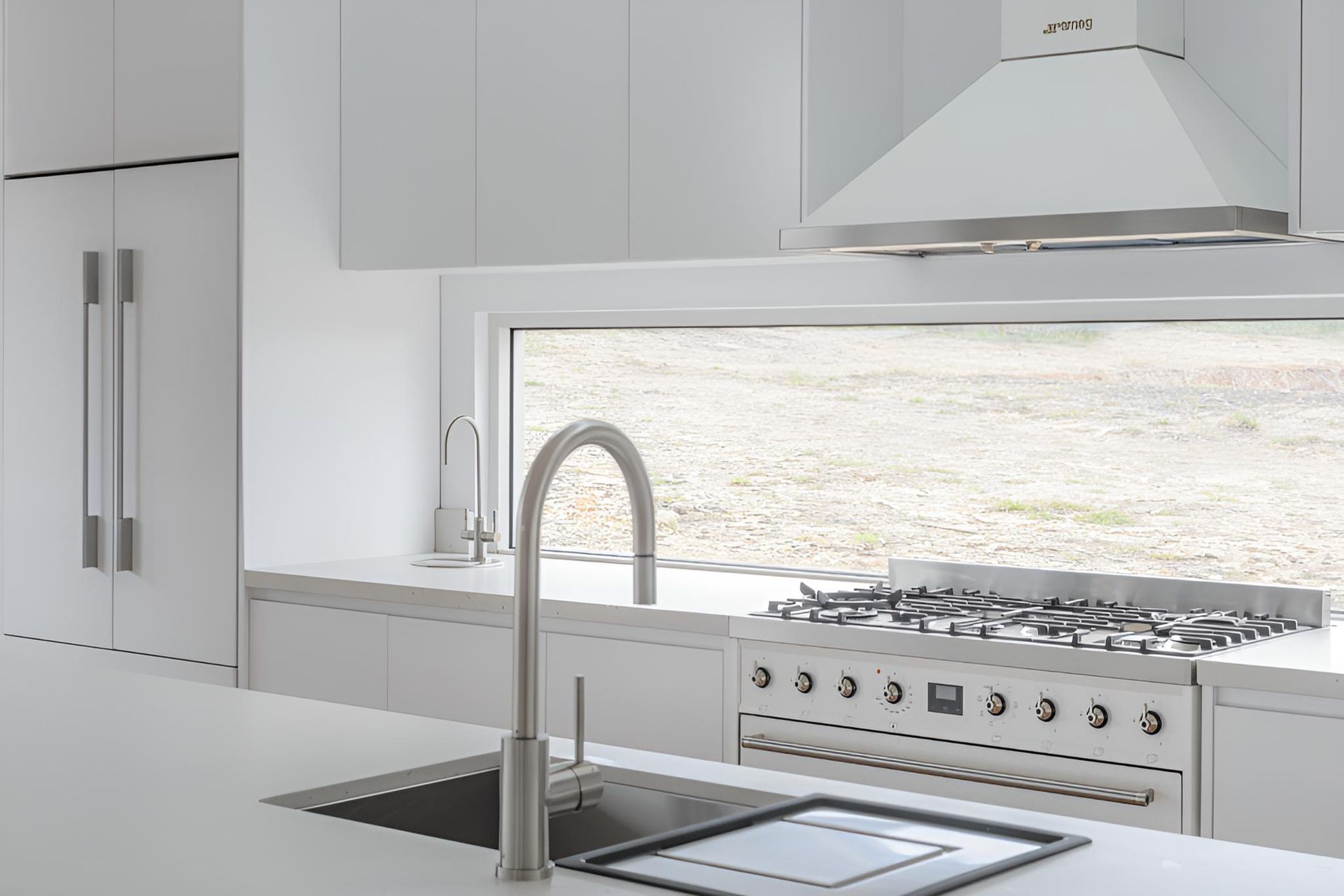 A Kitchen With a Stove , Sink , and Window — Indie Living In Bennetts Green, NSW