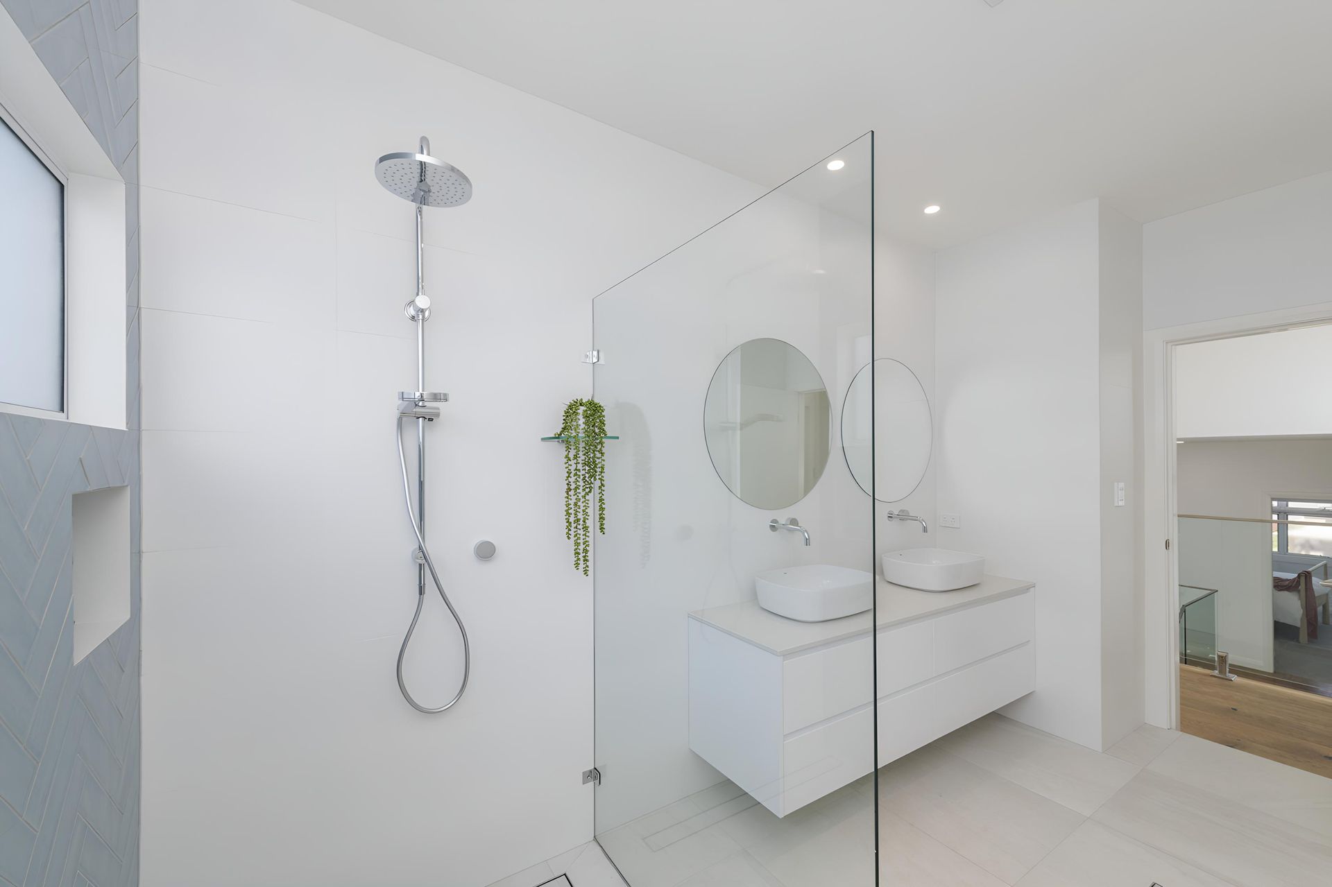 A Bathroom With a Walk in Shower , Sink and Mirror — Indie Living In Bennetts Green, NSW