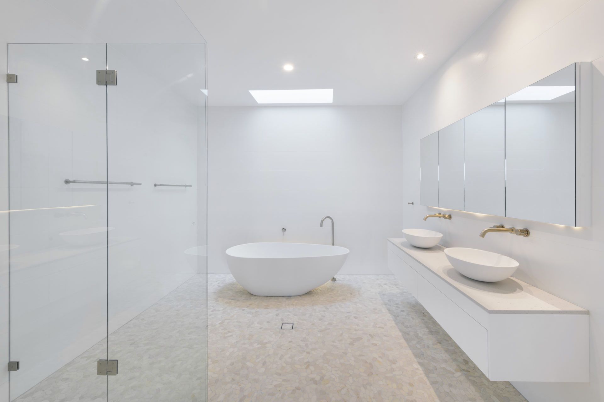 A Bathroom With a Bathtub , Sinks, Mirrors and a Walk in Shower — Indie Living In Bennetts Green, NSW