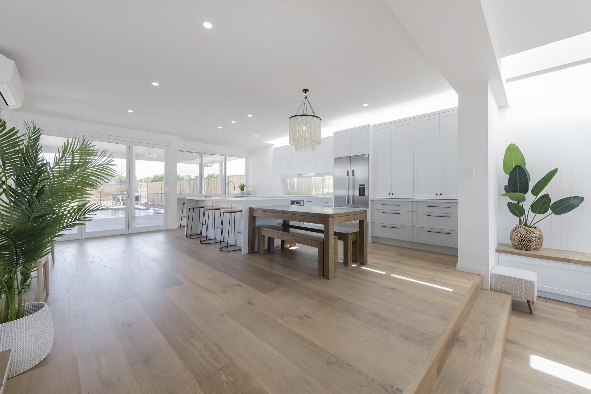 A Kitchen With a Wooden Table and Benches in It — Indie Living In Bennetts Green, NSW