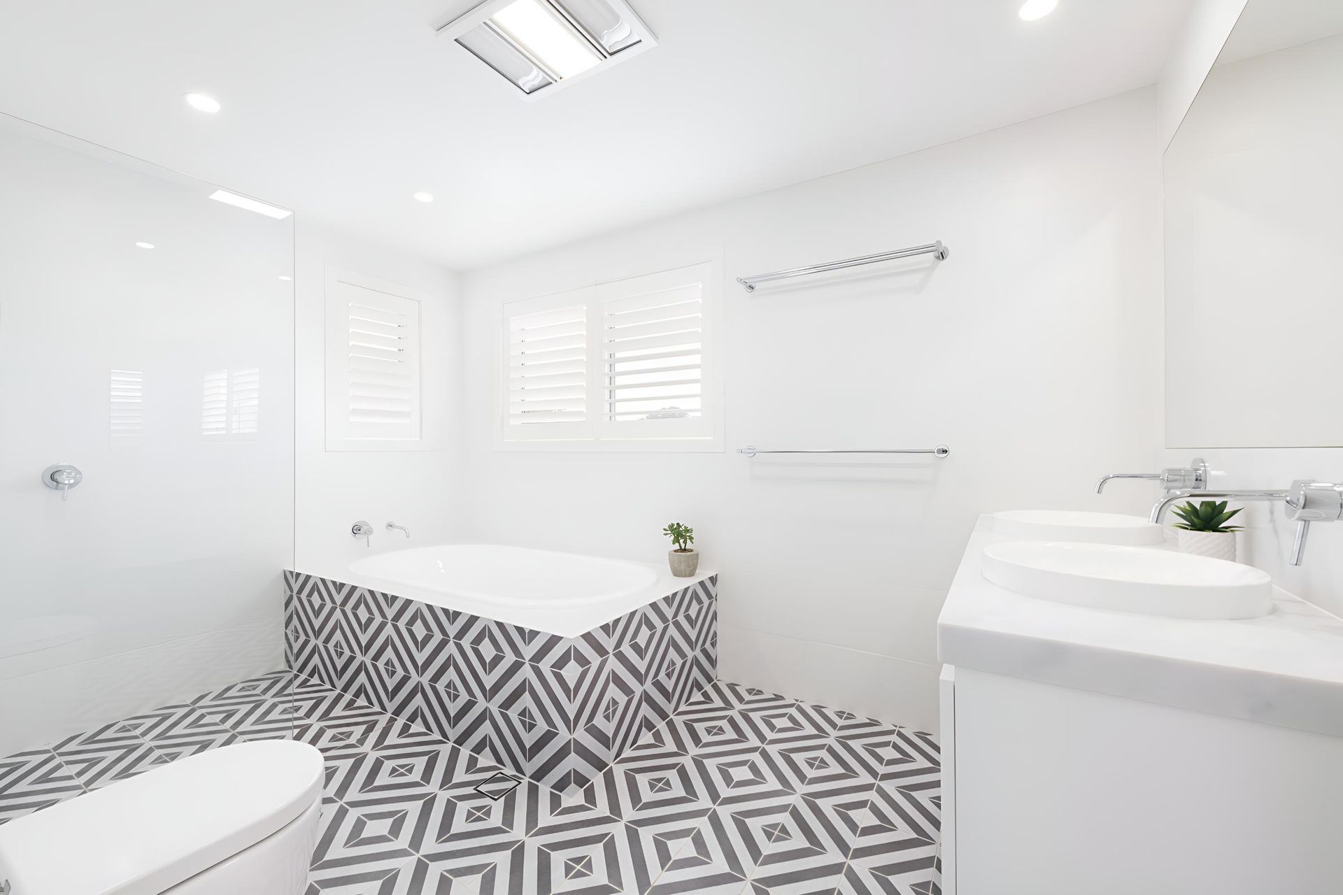 A Bathroom With a Bathtub , Toilet , Sink and Shower — Indie Living In Bennetts Green, NSW
