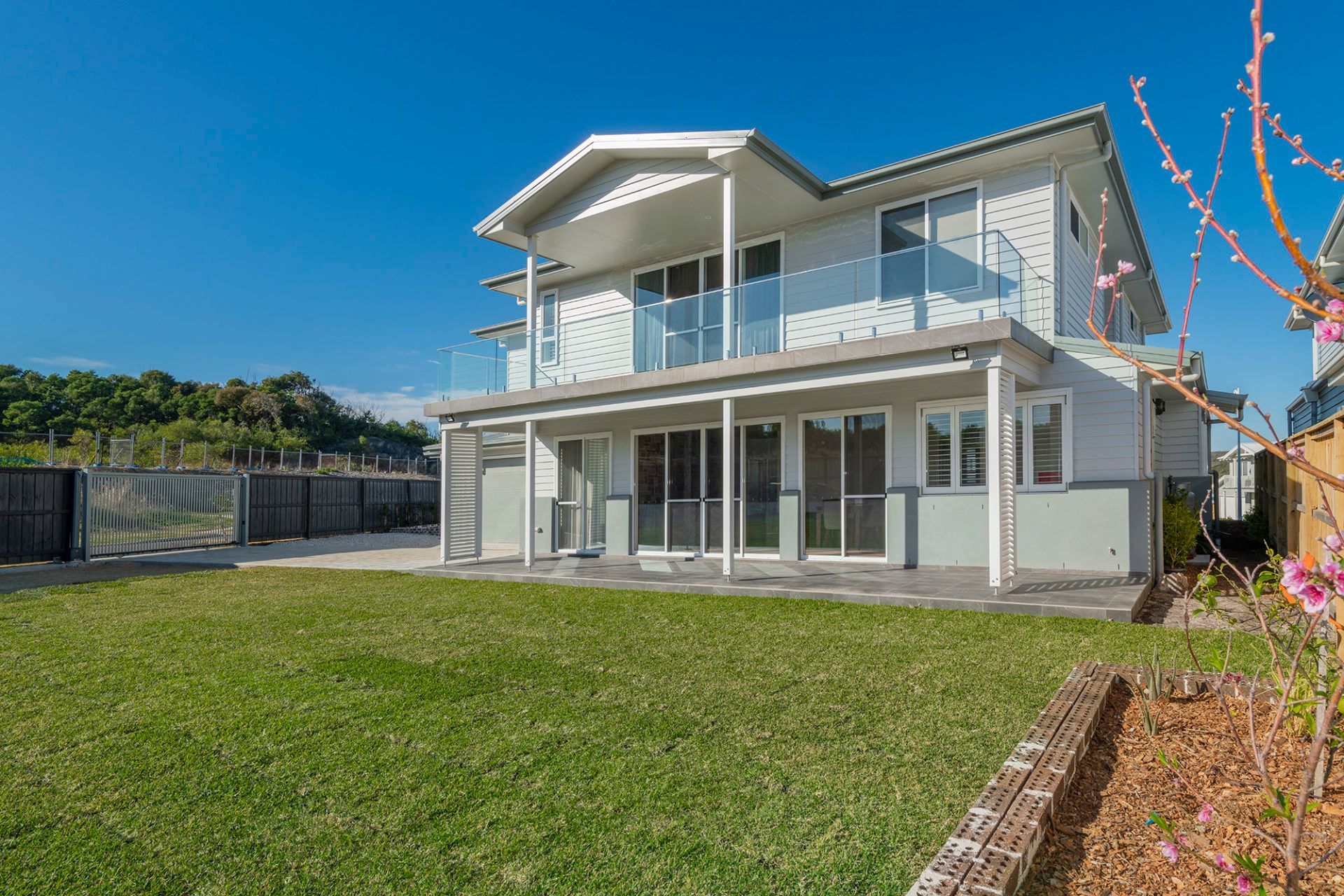 A Large White House With a Large Lawn in Front of It — Indie Living In Bennetts Green, NSW