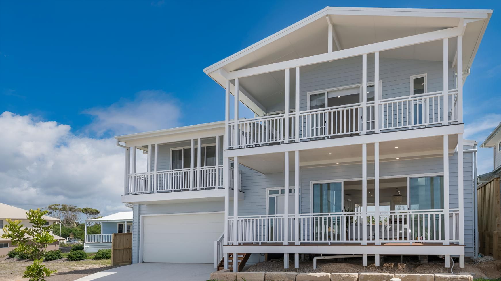 A Large White House With a Lot of Windows and Balconies — Indie Living In Bennetts Green, NSW
