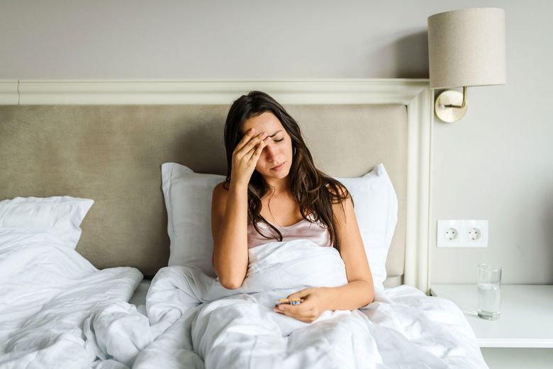 Woman ill in bed
