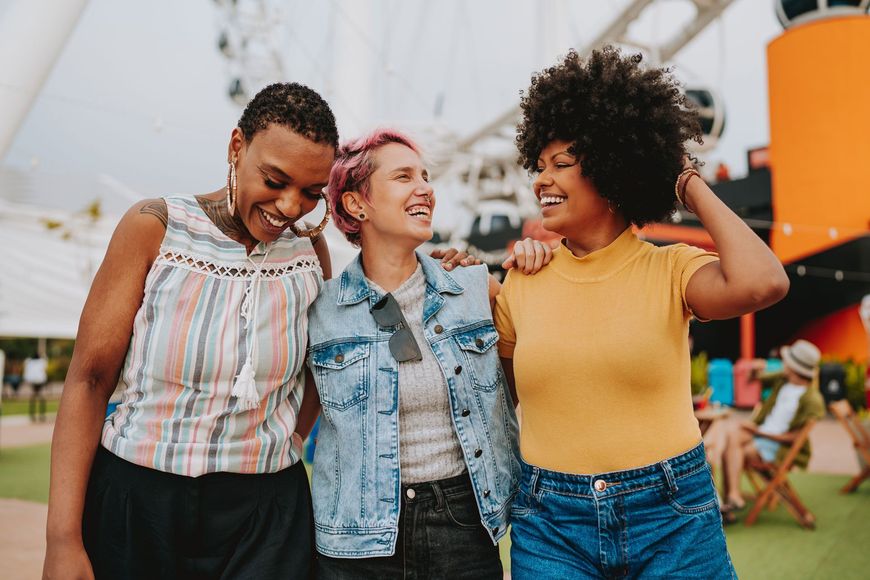 Three women smiling