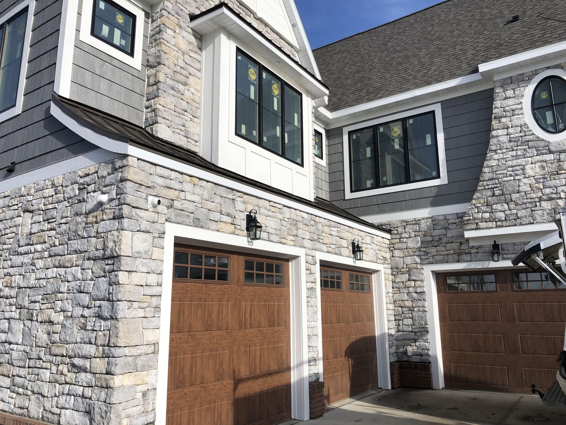 large house covered in manufactured stone veneer