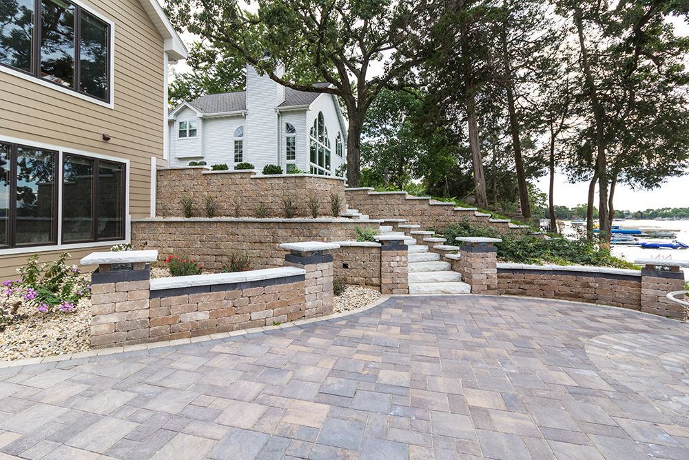 stone pavers on a path next to a retaining wall