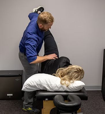 Dr. Condry at a Postural Restoration session with a patient.