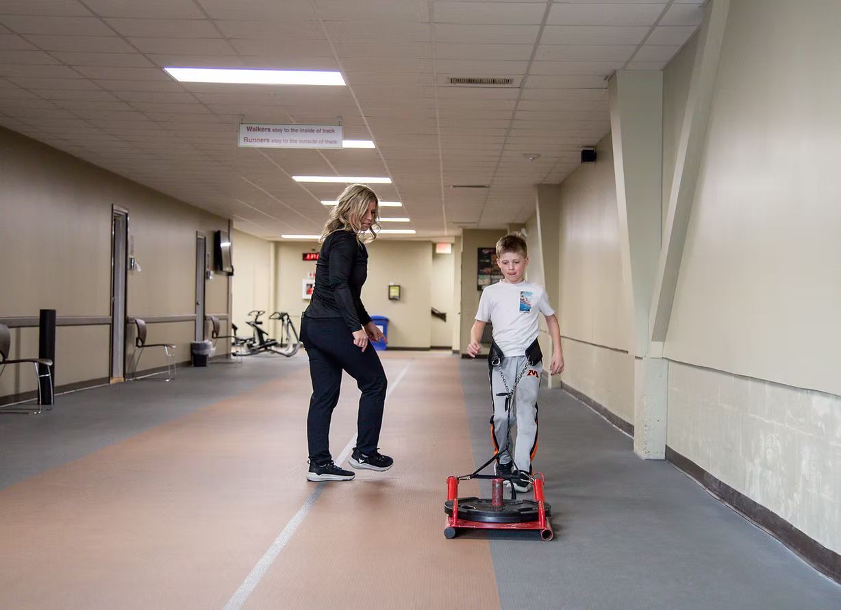 Dr. Tara with a young patient.