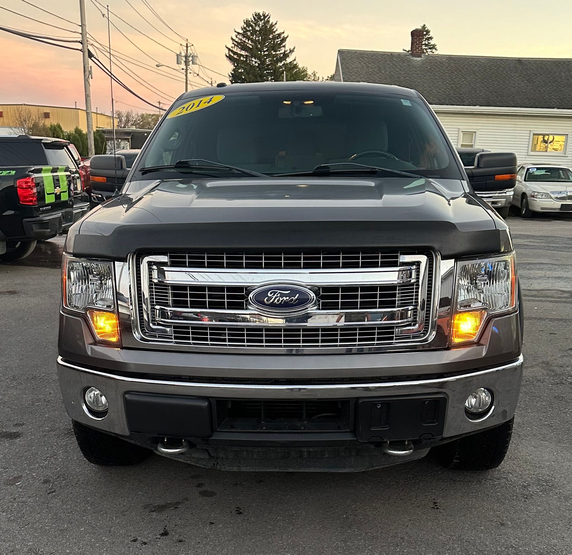 A ford truck is parked in a parking lot