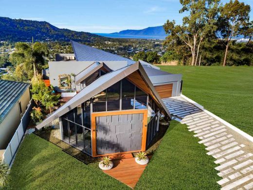 An Aerial View of a House With Mountains in the Background — Omni Builders In Bungalow, QLD