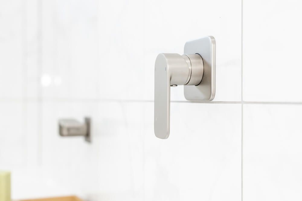 A Close Up of a Shower Head in a Bathroom — Omni Builders In Bungalow, QLD