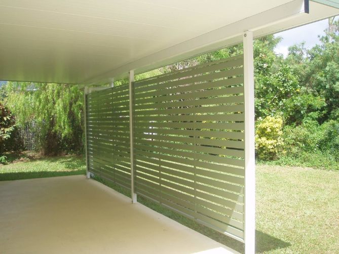 A Patio With a Fence and Trees in the Background — Omni Builders In Bungalow, QLD
