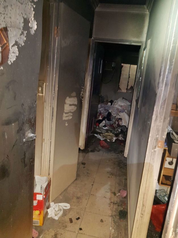 A Hallway With A Door Open And A Lot Of Trash On The Floor — Omni Builders In Bungalow, QLD