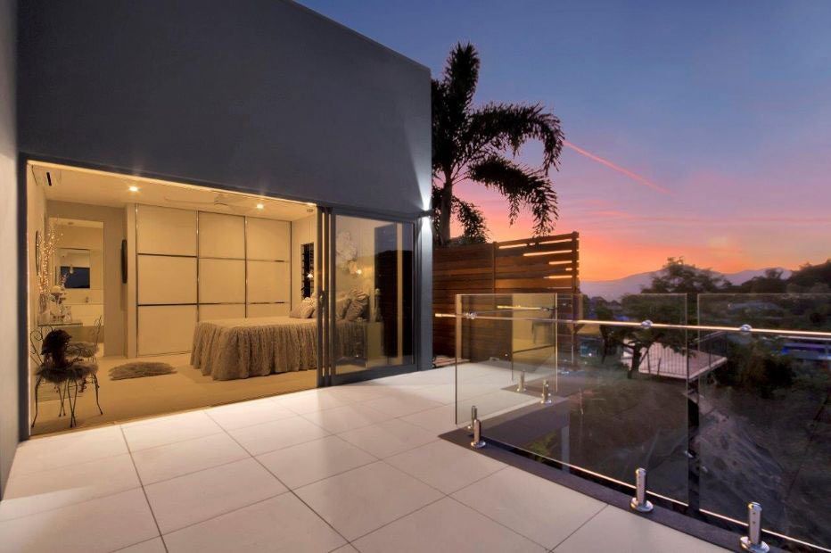 A Balcony With A View Of A Bedroom And A Sunset — Omni Builders In Bungalow, QLD