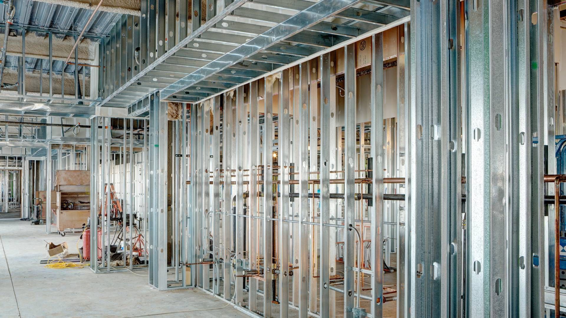 A building under construction with a lot of metal frames.