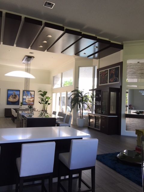 A large room with a table and chairs in it