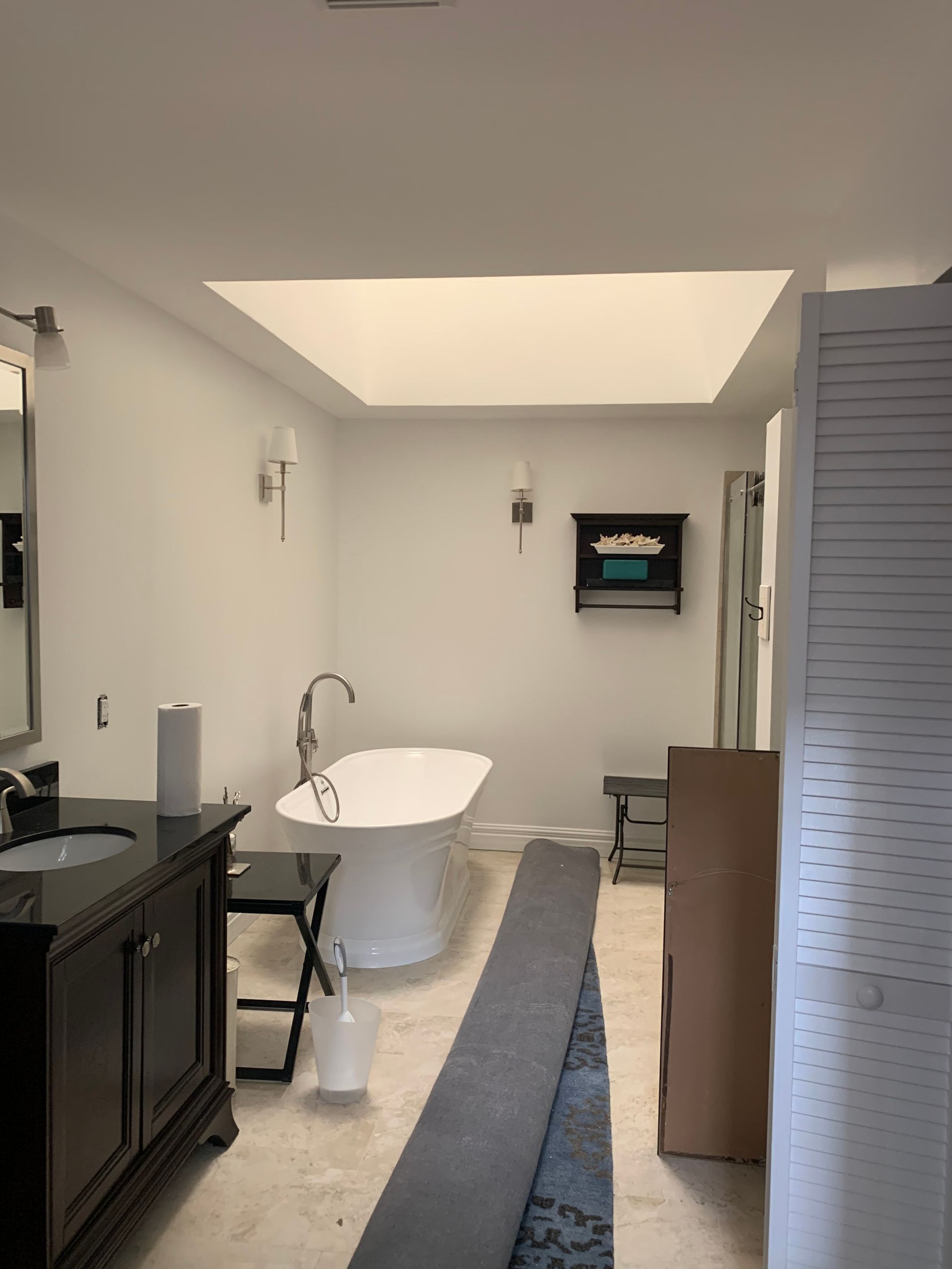 A bathroom with a bathtub and a sink