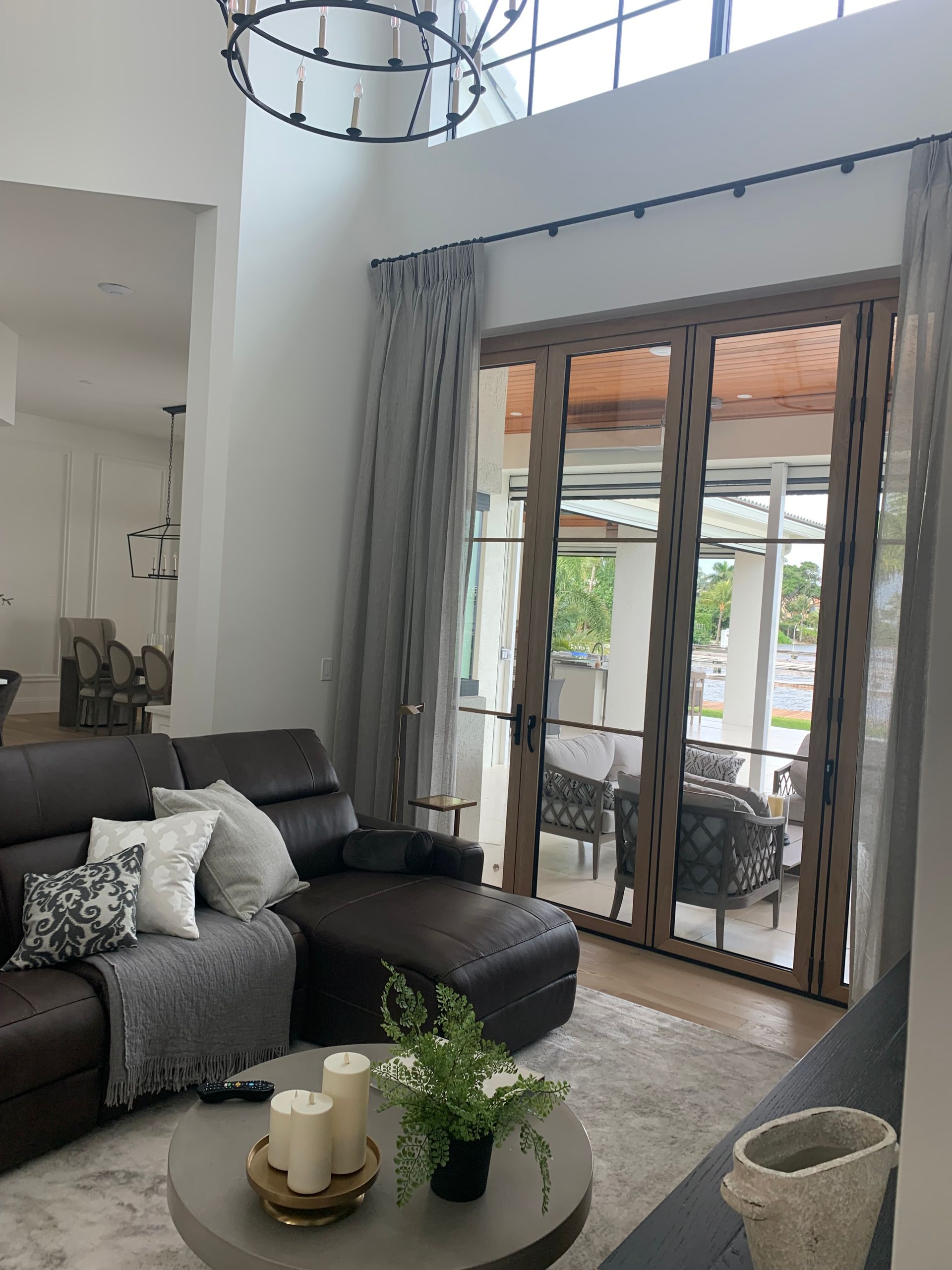 A living room with a couch and a table with candles on it