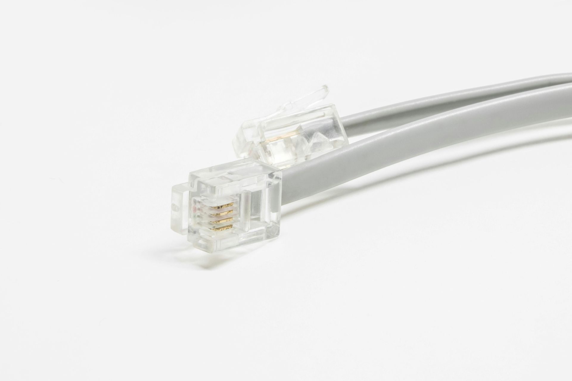 Perfume bottle and box on green grass, both labeled 