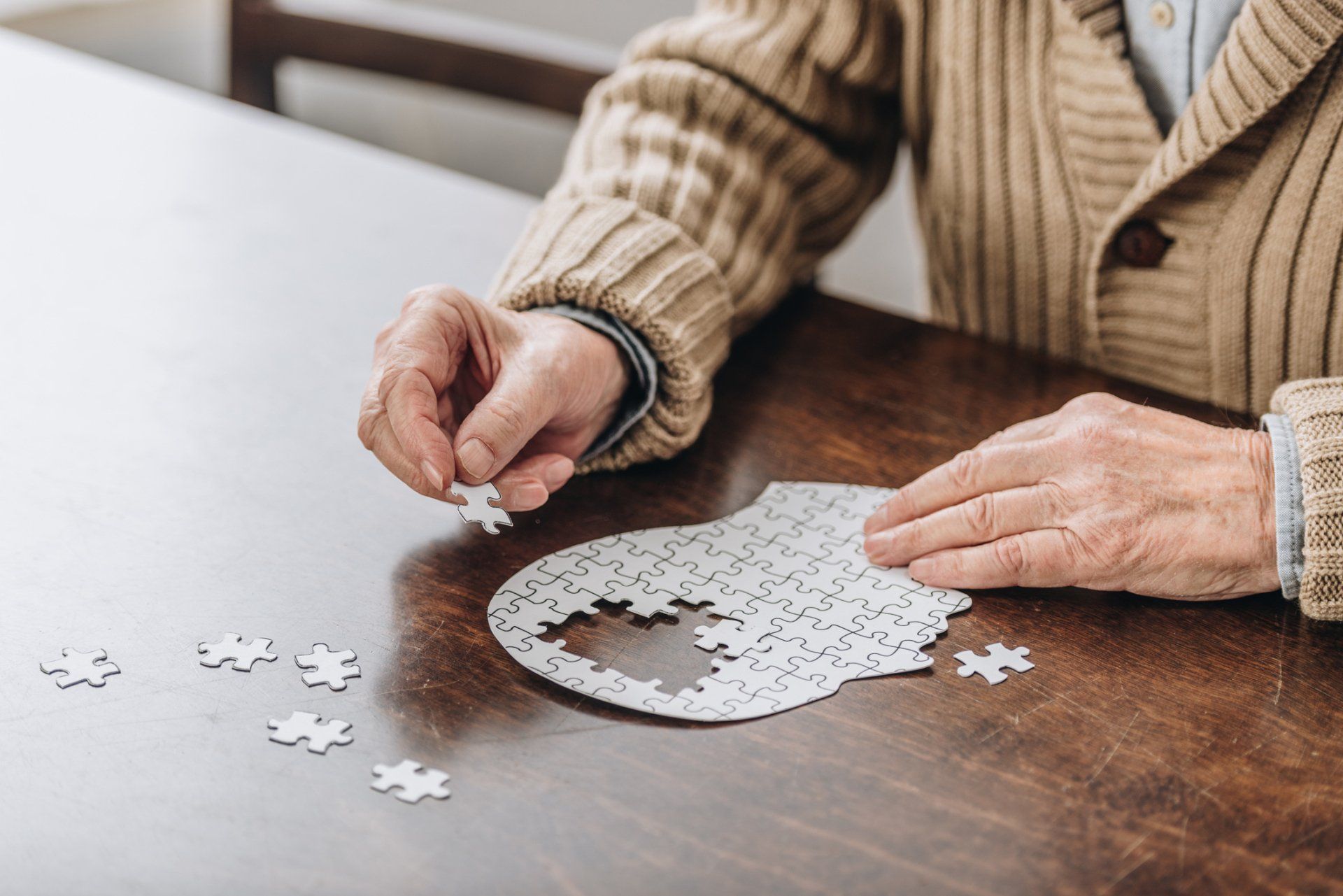 Senior Man Playing with Puzzles — Lakeland, FL — Better Living for Seniors of Polk County