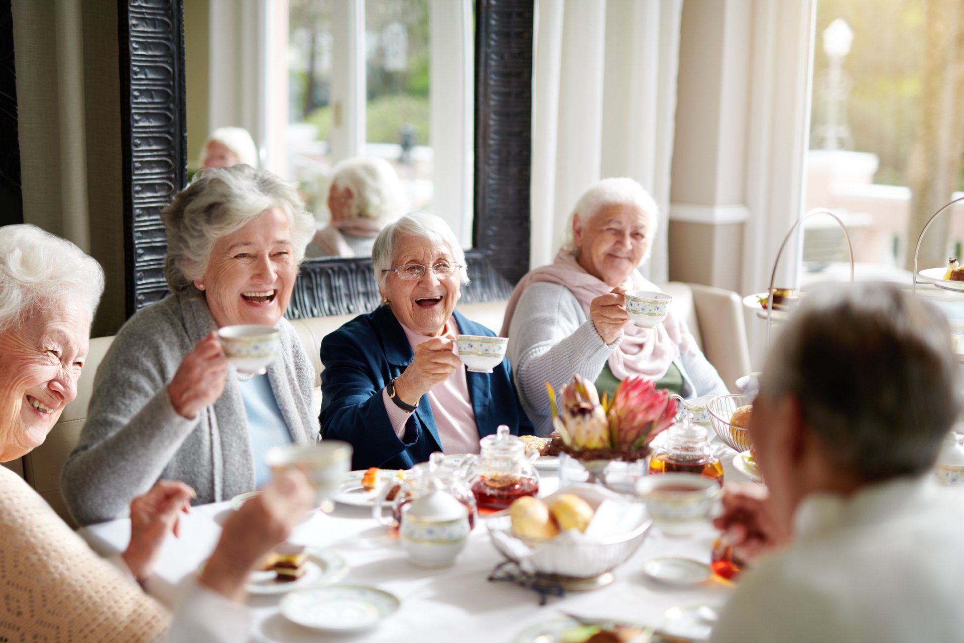 Group of Seniors Having Tea — Lakeland, FL — Better Living for Seniors of Polk County