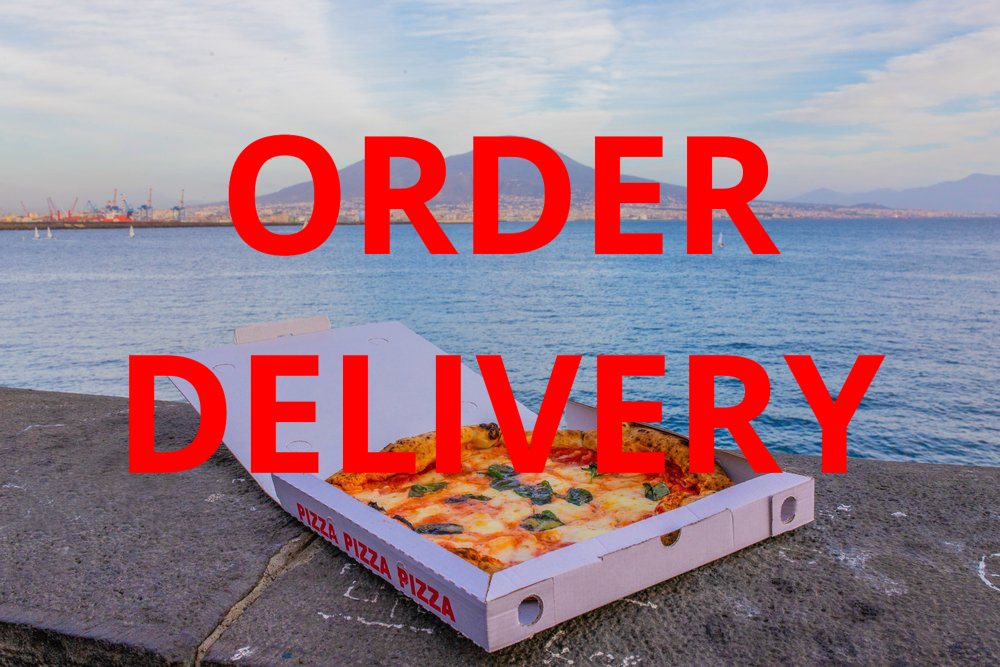 A Pizza in A Box on A Stone Wall — Stoked Pizza in Helensvale, QLD