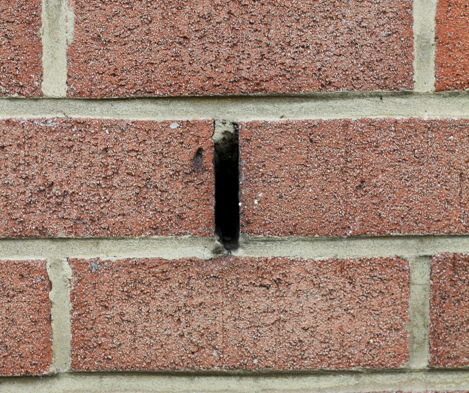Weep hole in a brick wall