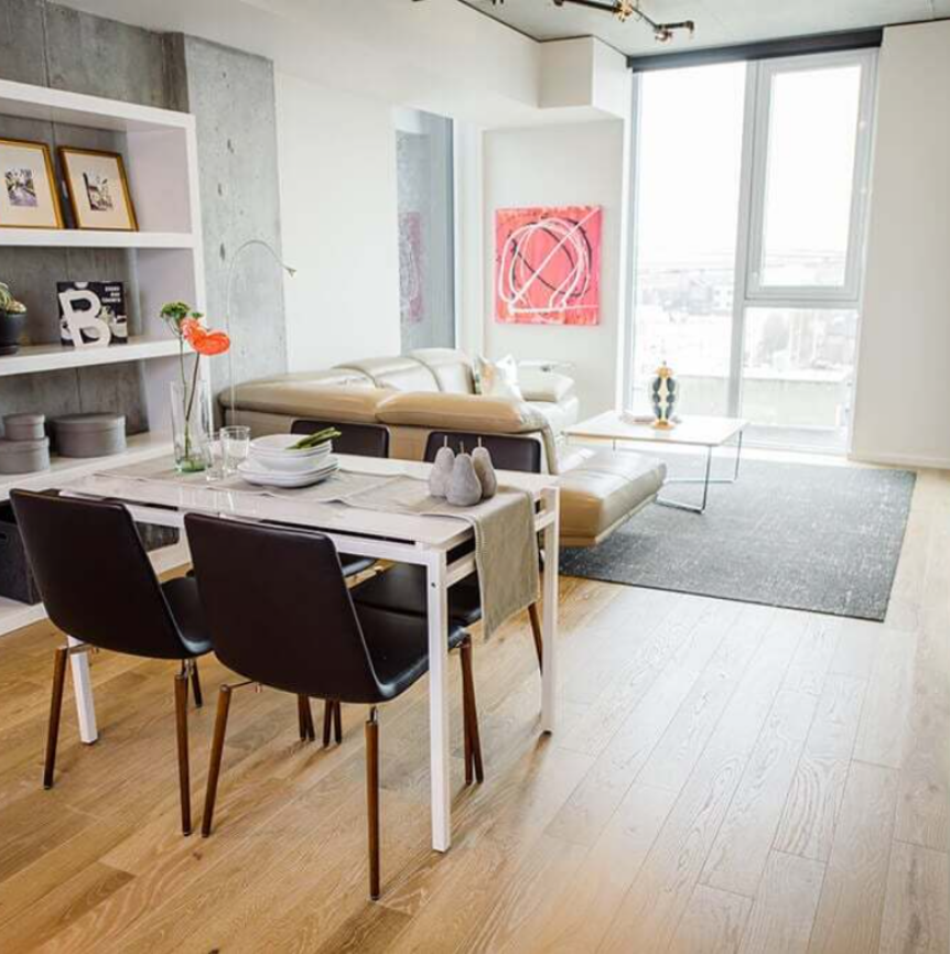 A living room with a table and chairs and a couch