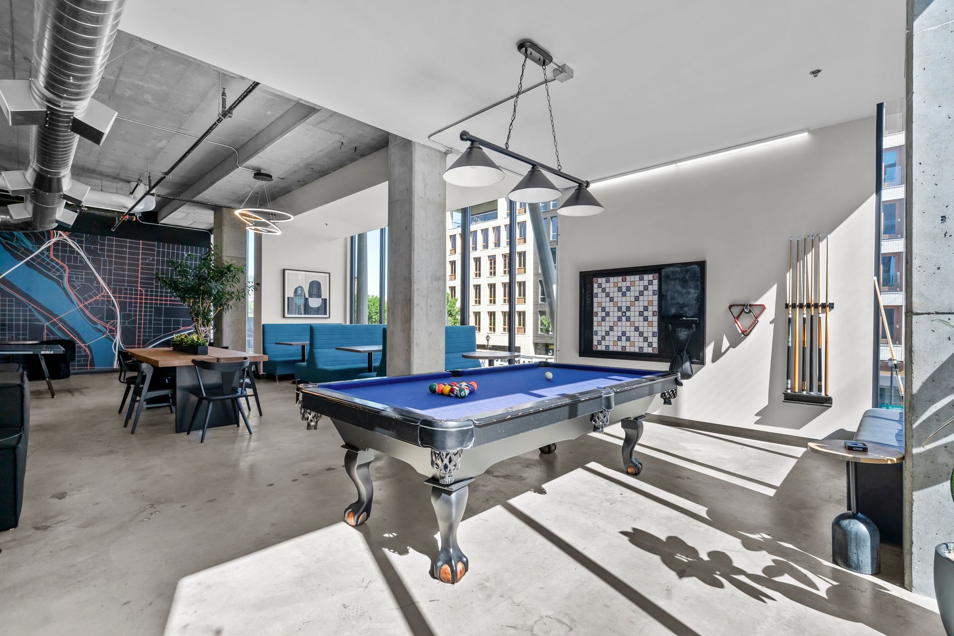 There is a pool table in the middle of the room.