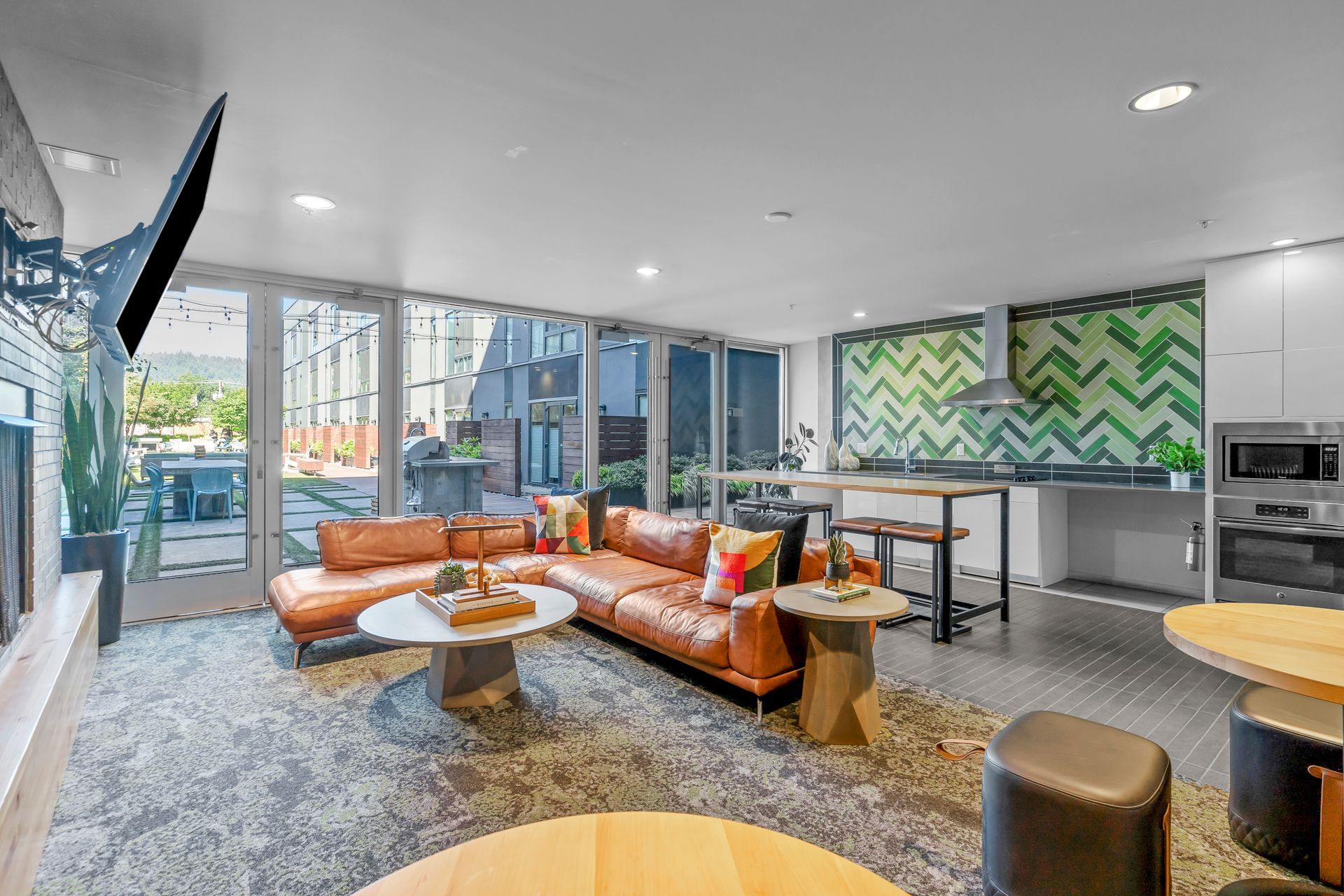 A living room with a couch , table , and television.