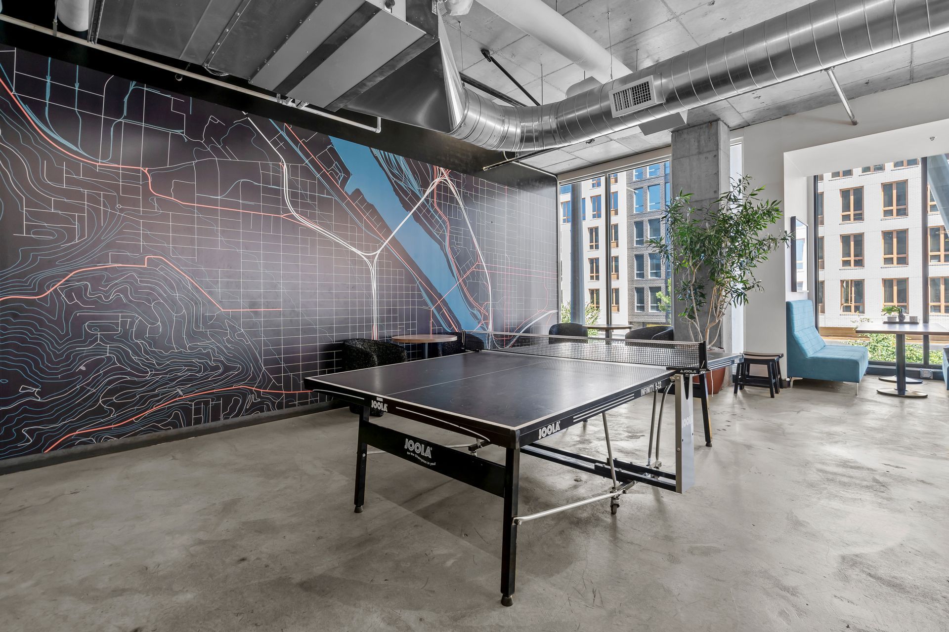 There is a ping pong table in the middle of the room.