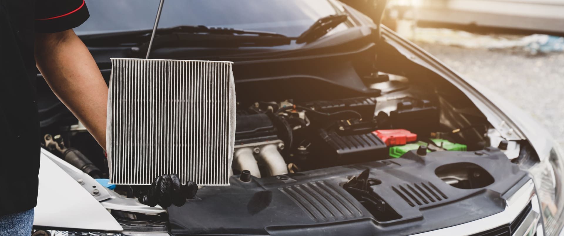 Car care maintenance servicing technician or auto mechanic holding car air conditioner filter for check and clean dirty or fix repair heat have engine problem or replace new change air filter