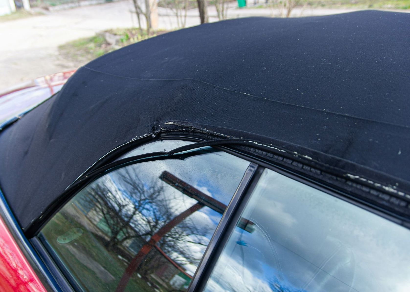 A close up of the roof of a convertible car.