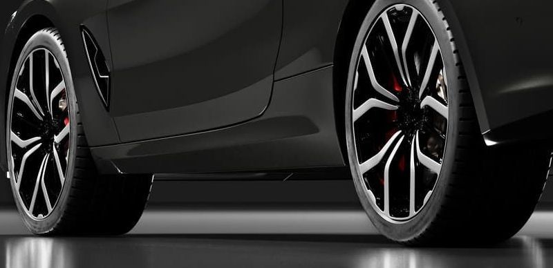 Car wheels close up on a background of asphalt. Car tires. Car wheel close-up