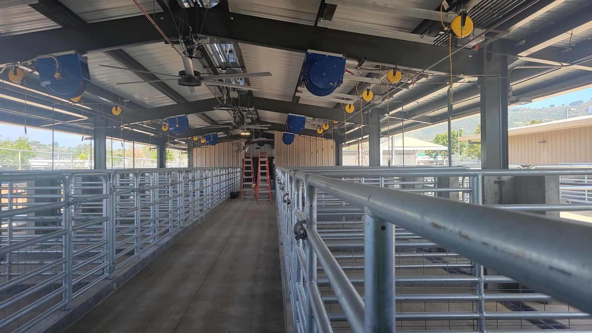 A large building with a lot of fences and a lot of windows.
