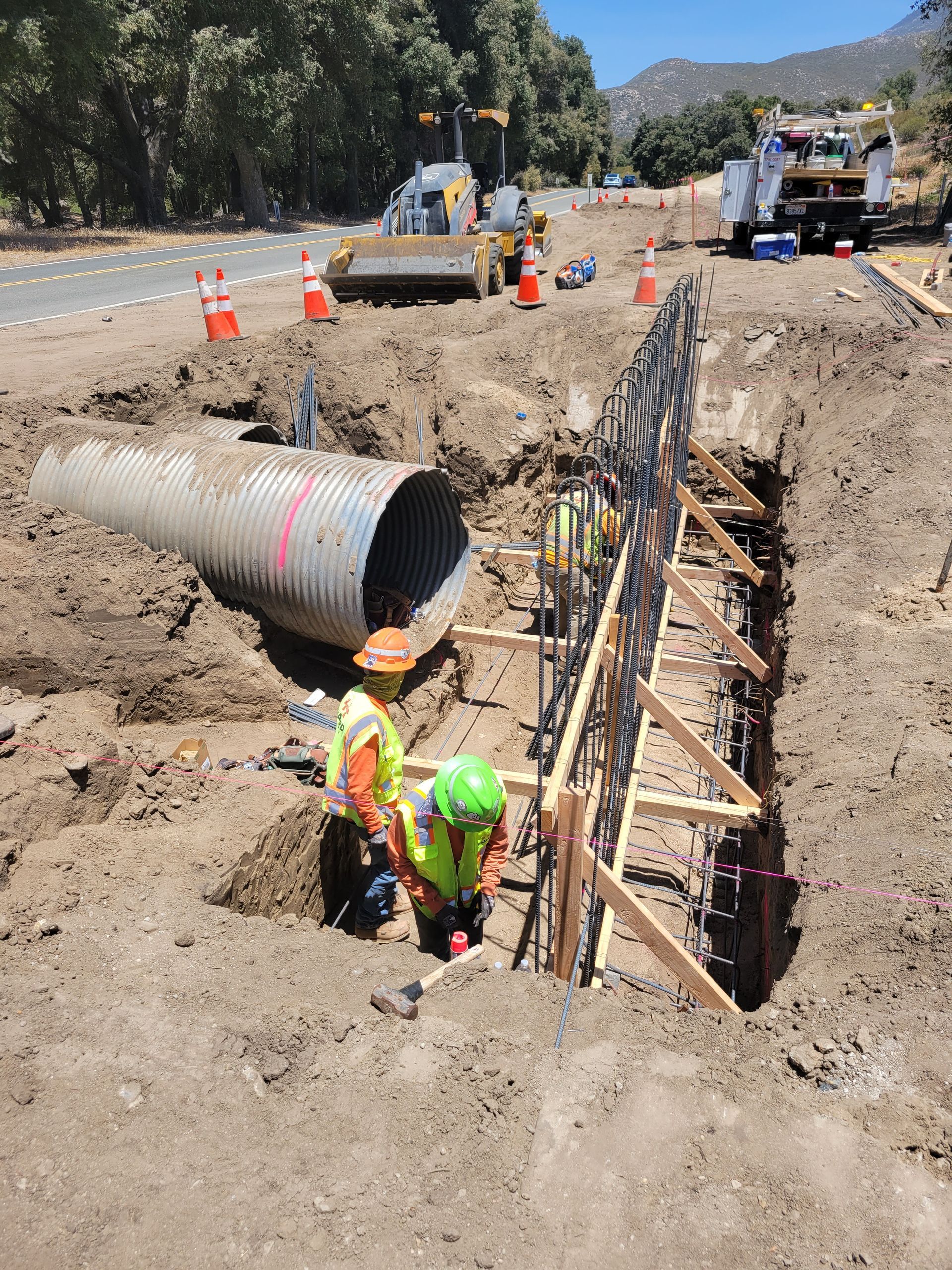 A group of construction workers are working on a construction site.