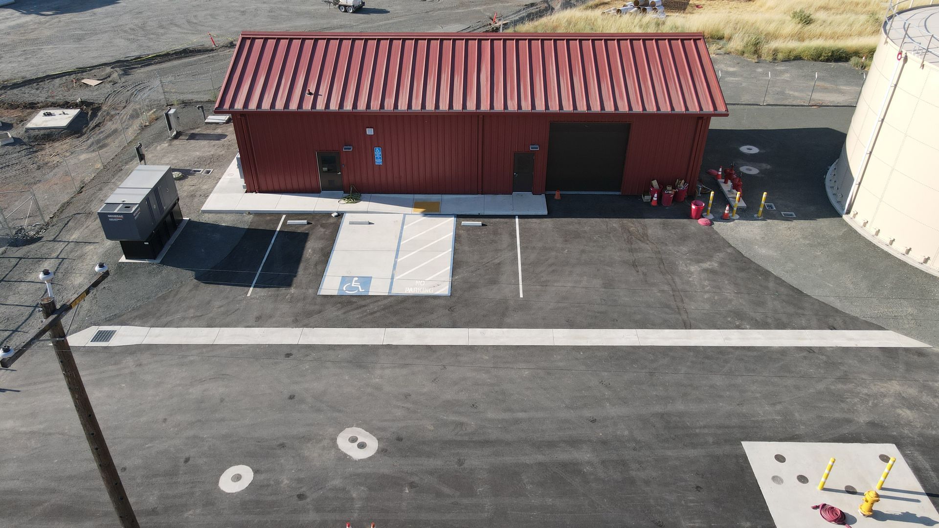 An aerial view of a building with a red roof