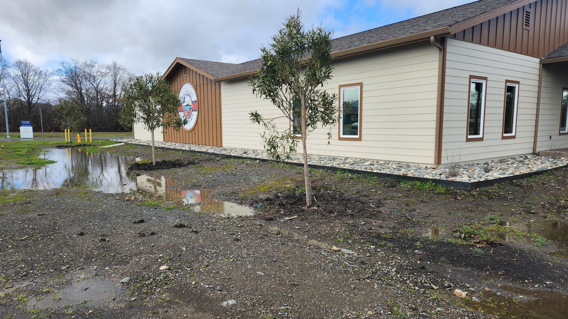 A building with a lot of windows and trees in front of it