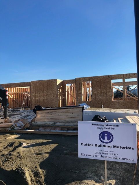 A construction site with a sign for cutter building materials