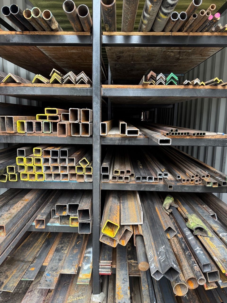 A pile of metal pieces with holes in them