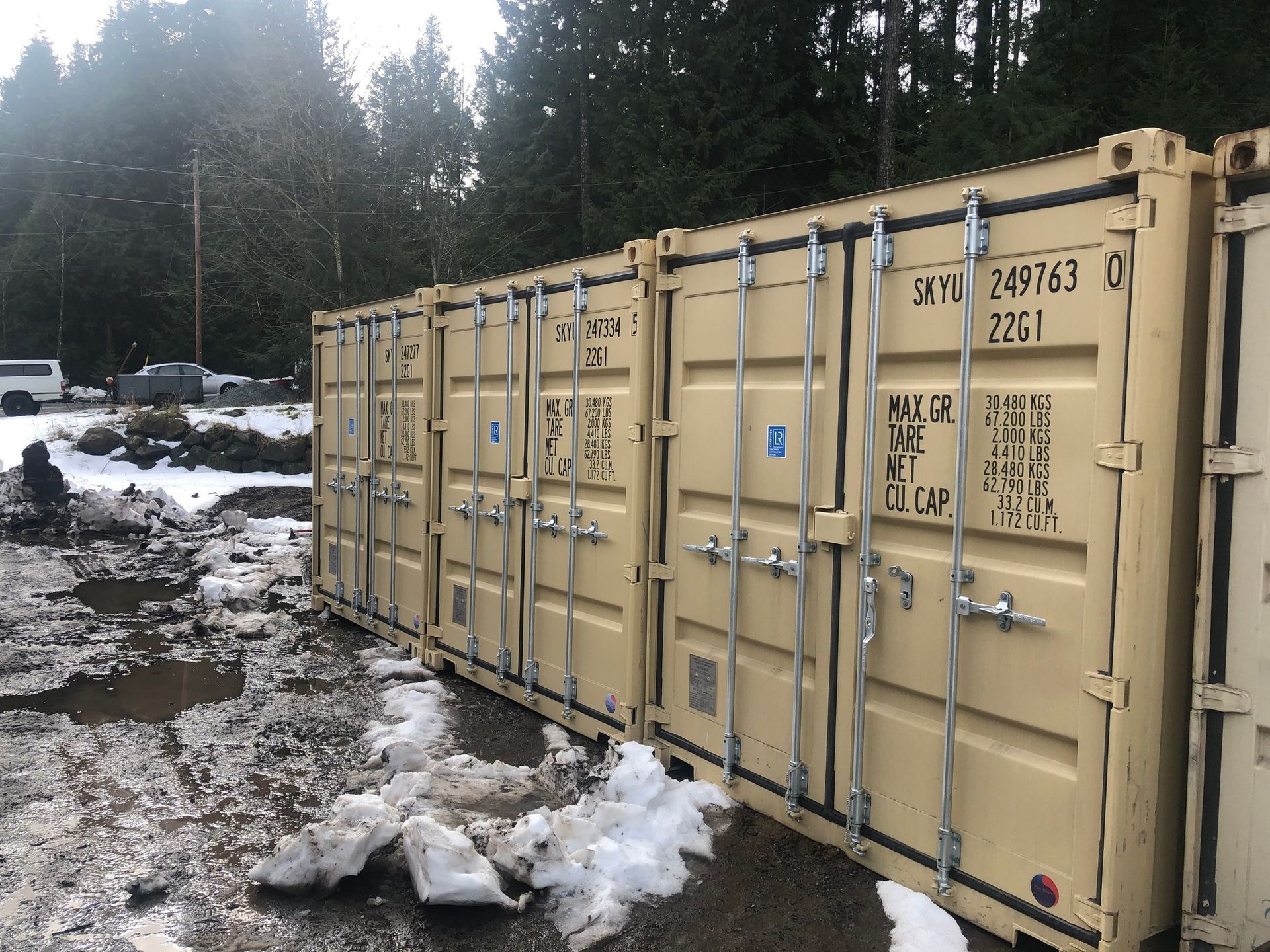 A row of shipping containers with the number 2261 on them