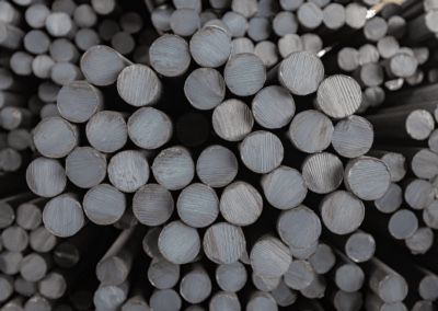 A close up of a pile of metal rods stacked on top of each other.