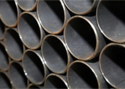 A bunch of metal pipes stacked on top of each other