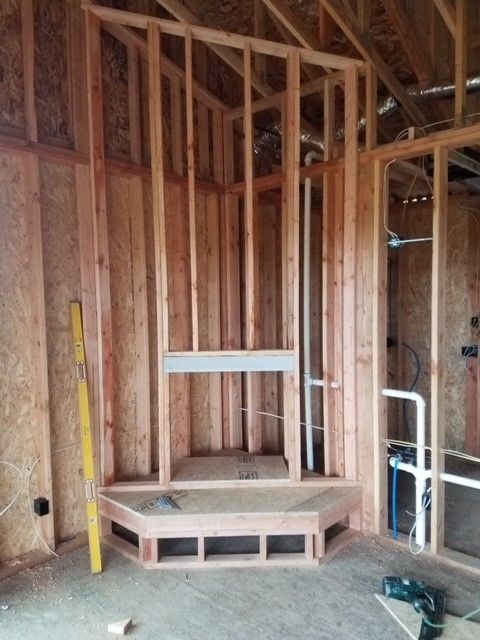 A room that is being built with a fireplace in it