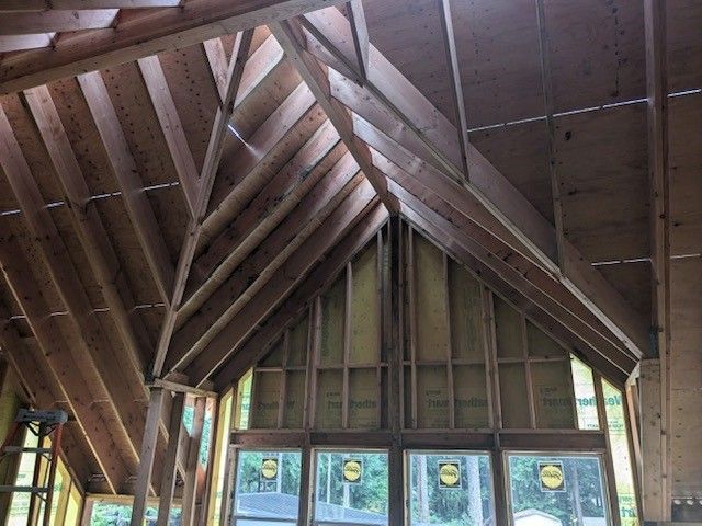 The inside of a building under construction with a vaulted ceiling