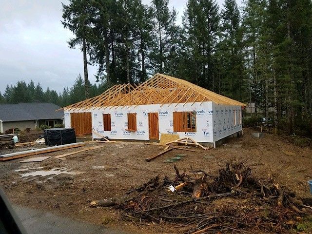 A house is being built in the middle of a forest.