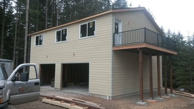A house with a car parked in front of it