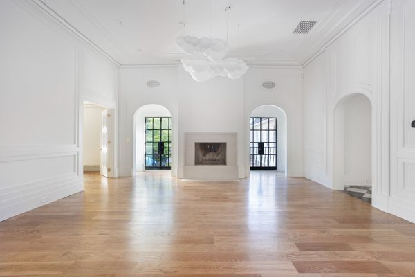 There is a fireplace in the middle of the room.