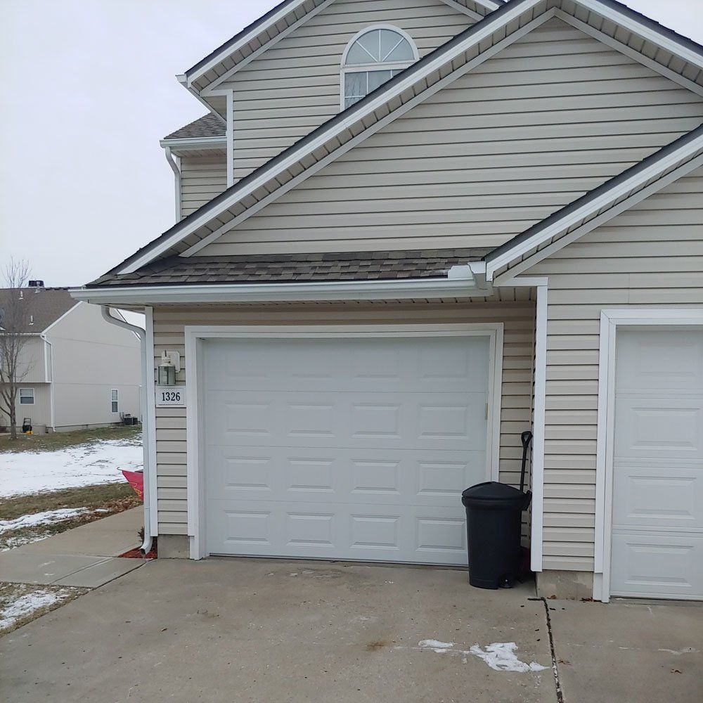 before and after picture of broken garage door and replacement